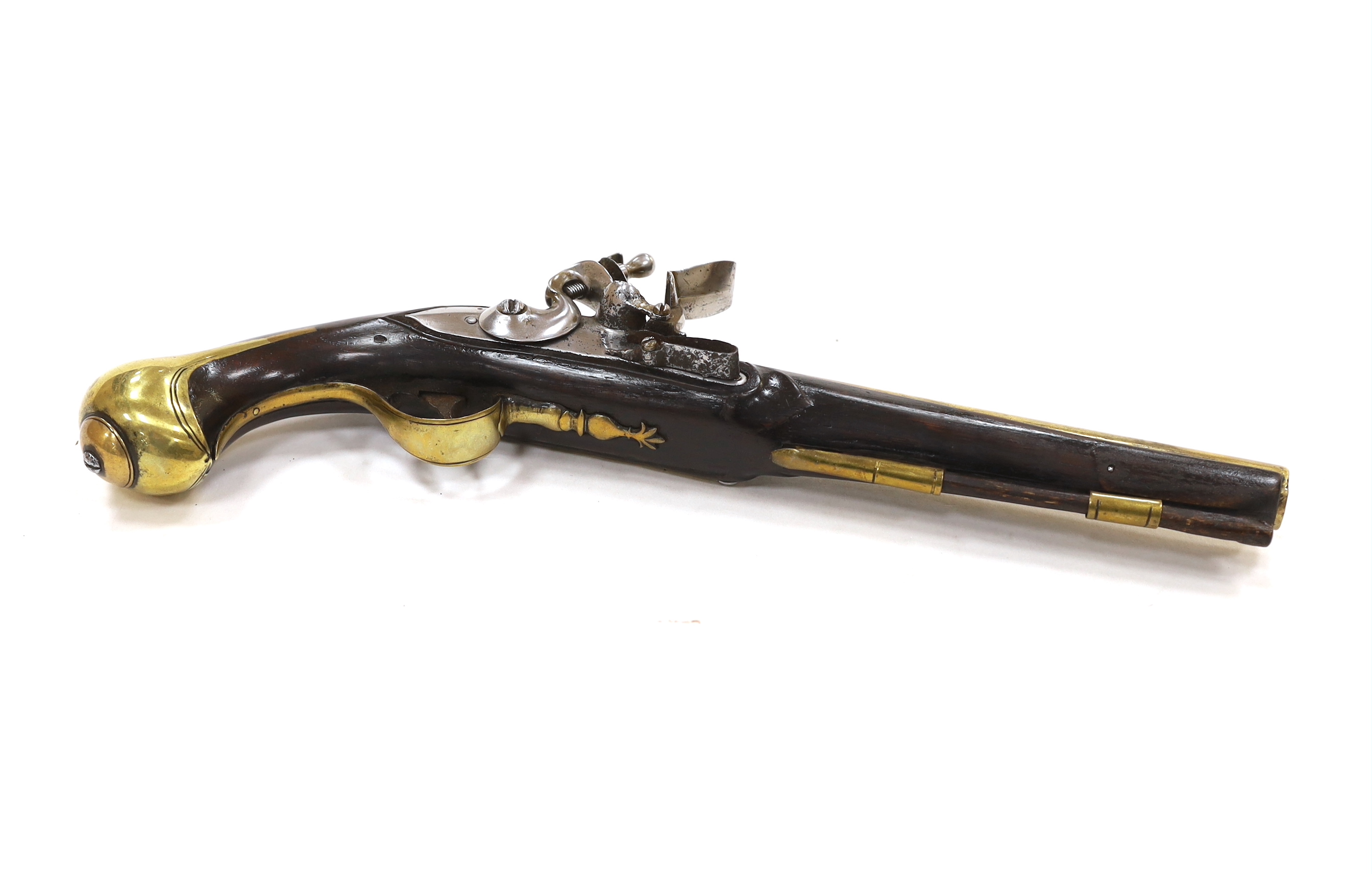 A composite 20 bore brass barrel, flintlock holster pistol, fitted with brass mounts, long spur butt cap and fully stocked